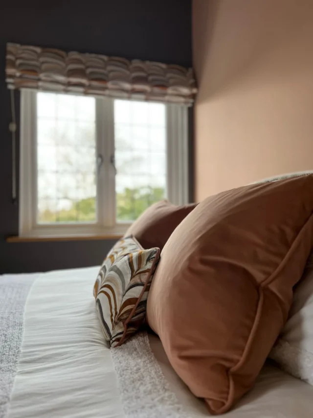 Close up of bed cushions in eaves bedroom