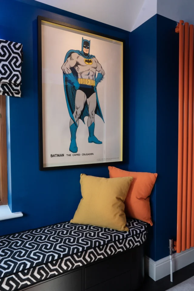 Upholstered storage in a home office showing colourful cushions and radiator